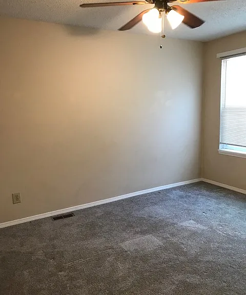 Bedroom 1 with light fan.