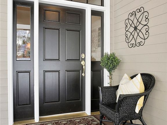 Experience sweeping lake views, outdoor living and entertaining on this expansive porch! French doors from the formal dining room and the library seamlessly blend interior and exterior spaces.