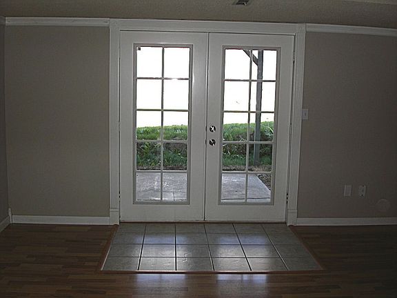 French doors lead to covered patio