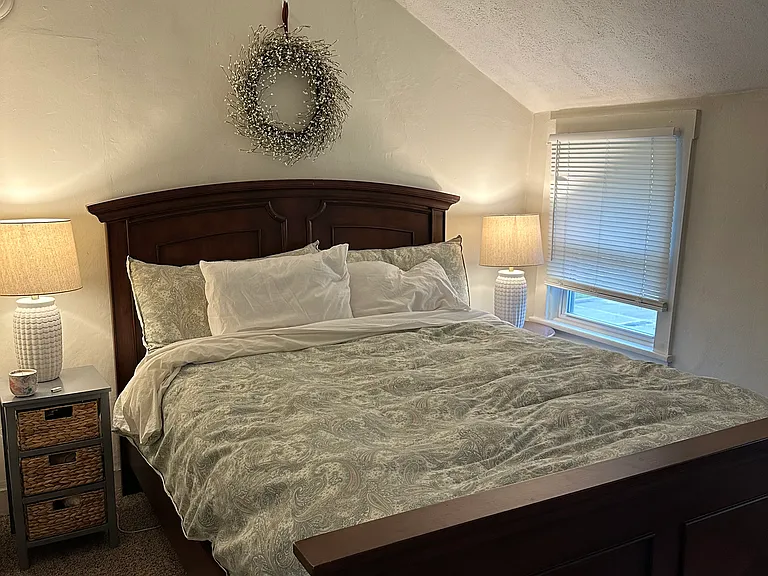 Main bedroom with ceiling fan and closet