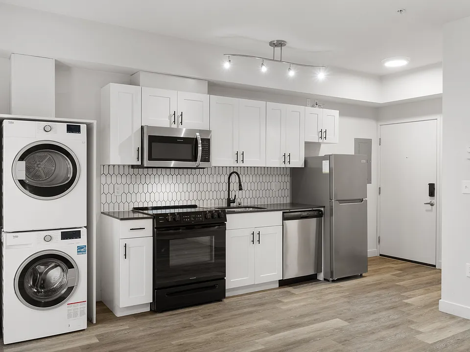 Everything you needmodern appliances, sleek finishes, and in-home laundry