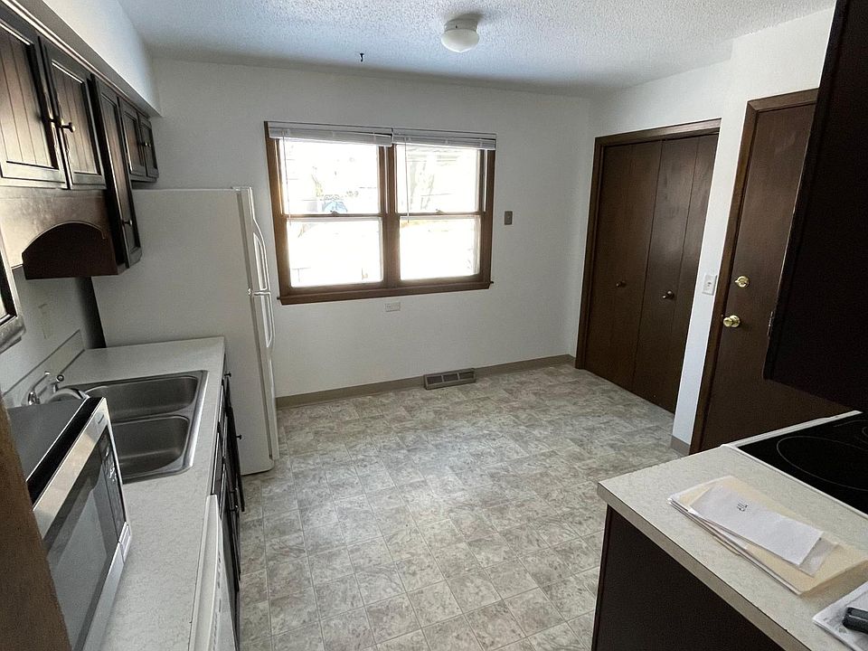 Kitchen has a kitchen nook with a large window.