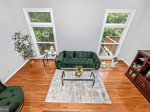 LIVING ROOM W/ HIGH CEILINGS AND NEWER WINDOWS