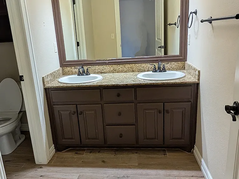 Second Bathroom off the hallway with double vanity.