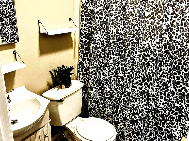 Tub shower combination with underneath storage .