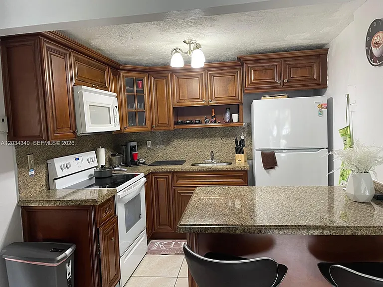 4275 NW South Tamiami Canal Dr #2-111 — Photo 1