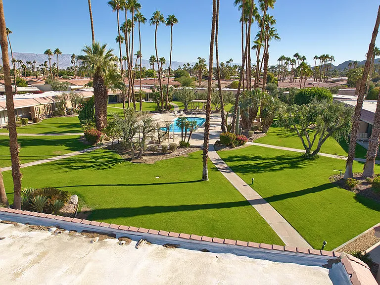 THERE IS AN EXPANSIVE LUSH PARK LIKE SETTING
