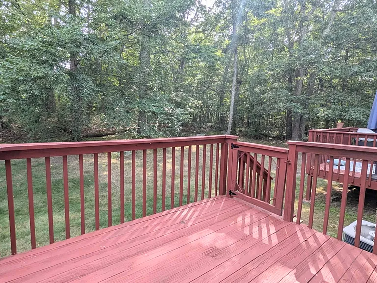 Patio with access to the grassy outdoor area.