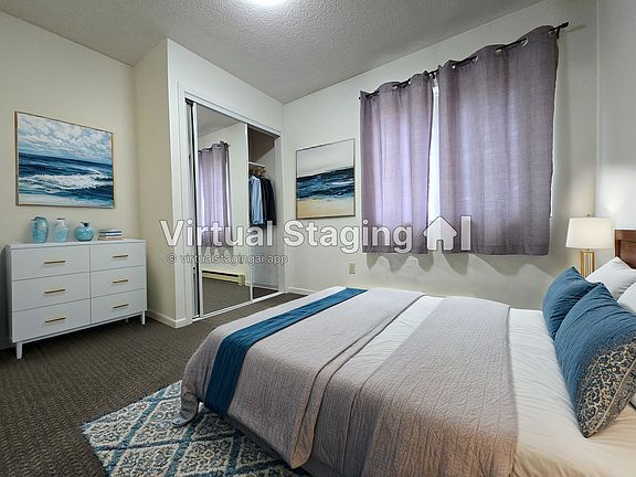 Bedroom mirrored closet and also has a 2nd closet behind bedroom door for extra storage
photo was virtually staged for layout inspiration