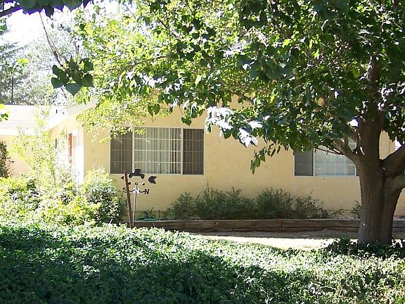 tree shaded home with well, city water