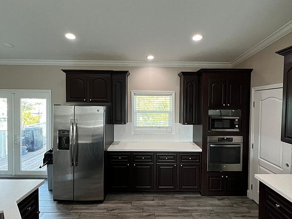 Comes with all stainless steel appliances. Refrigerator, Wall oven and microwave.