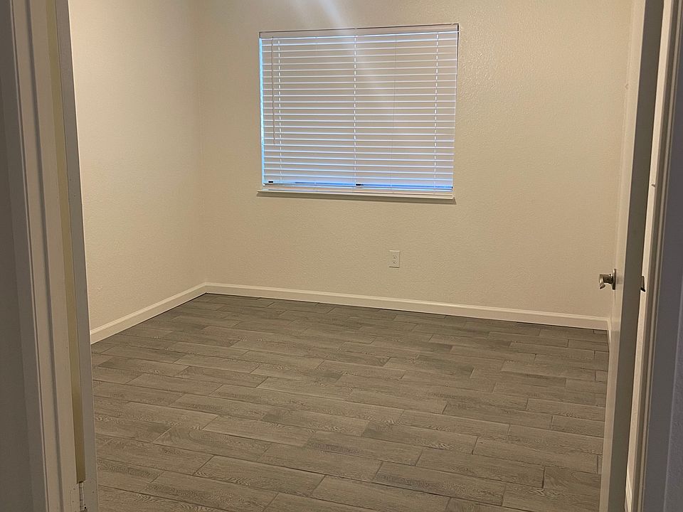 Spare bedroom with walk-in closet and double doors