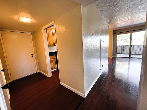 Hallway facing front door/Livingroom