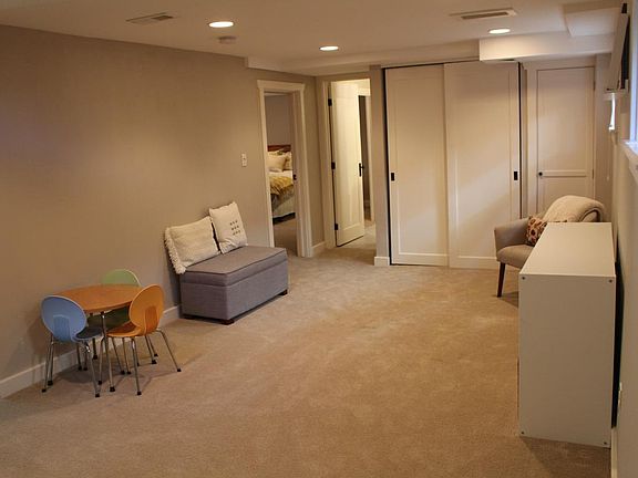 Finished basement with brand new carpet.