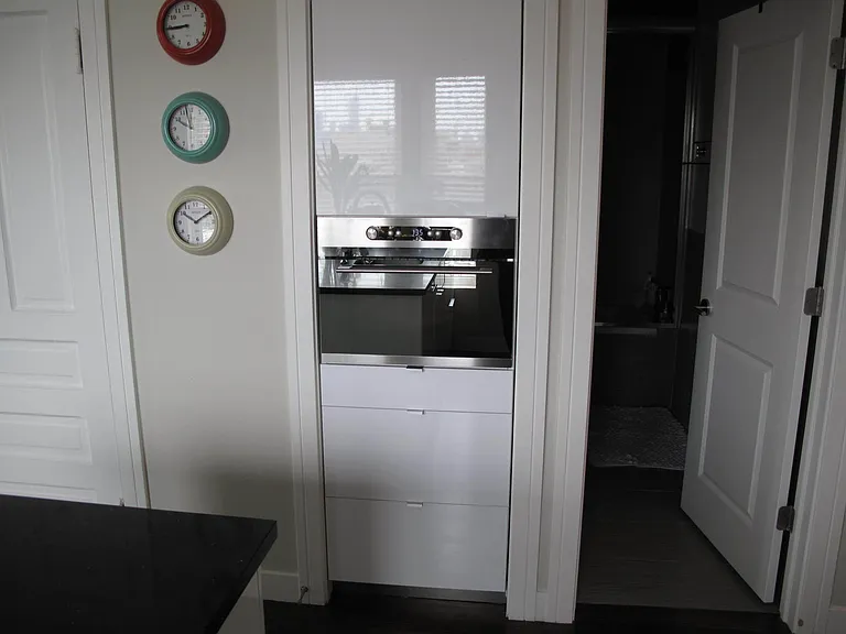 Built in Microwave with upper storage and drawers.