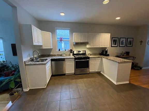 Stainless steel appliances, granite countertop, breakfast island with room for seating