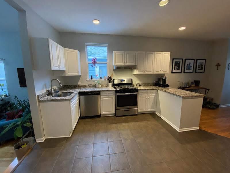 Stainless steel appliances, granite countertop, breakfast island with room for seating