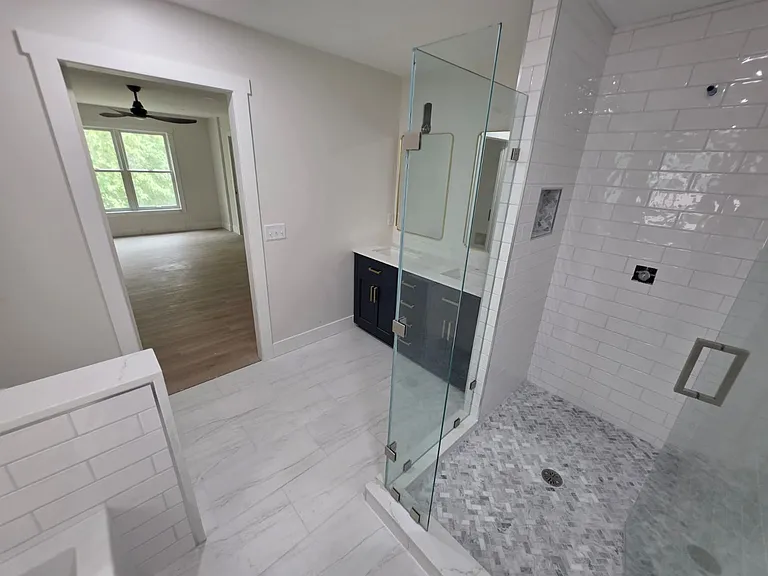 Master bath with separate tub and shower, and dual vanity.

Beautiful tile and marble finishes throughout.