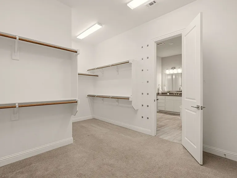 Primary Closet Attaches to Bathroom and Laundry.