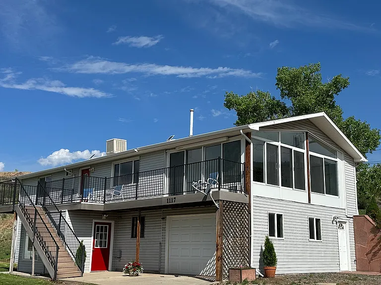 Two story home with one car garage and space for 3 more vehicles