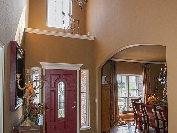 Open entry way with high ceilings and lovely chandelier.