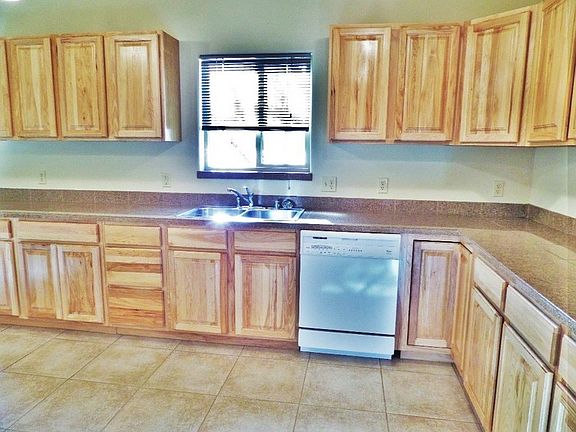 Kitchen
						:
						Beautiful hardwood cabinets with dishwasher.