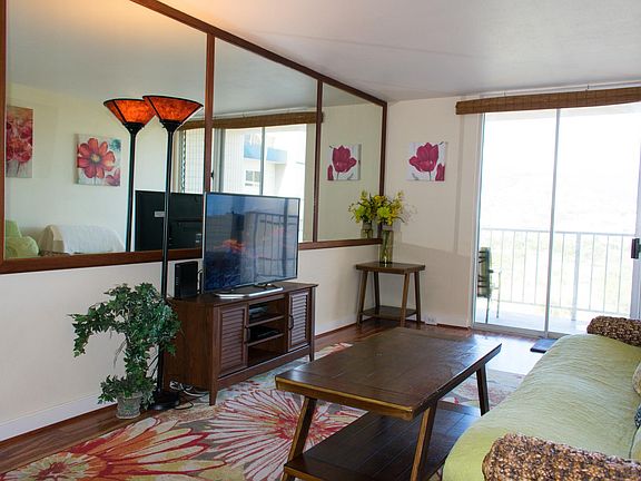 Furnished Living Room with a Flat Screen High Def TV and a dining area