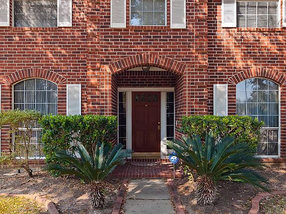 The sidewalk and front door invite you into this lovely home.