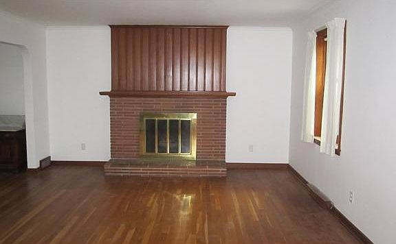 Hardwood living room with fireplace