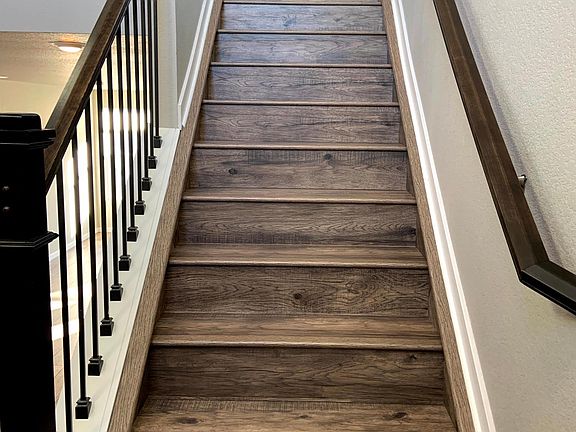 Looking up from the front door to the main level-kitchen, living room.