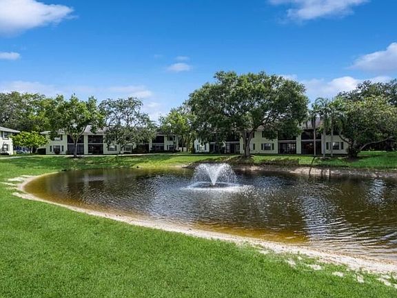 The lake is in the center of the complex with walking path around it.