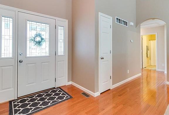 Gleaming hardwood floors in the entry foyer and down the hallway to the bedrooms
