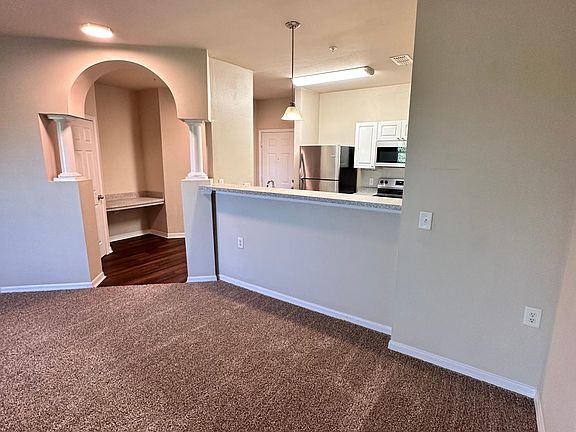 Overview of Entryway, Kitchen and Breakfast Bar