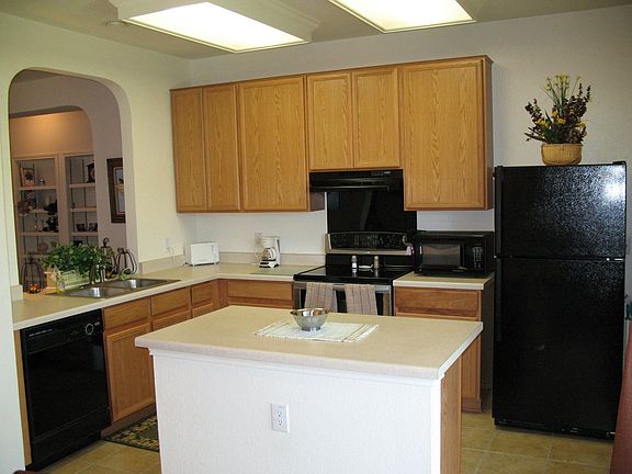 kitchen with tile floors and upgrade whirlpool appliances