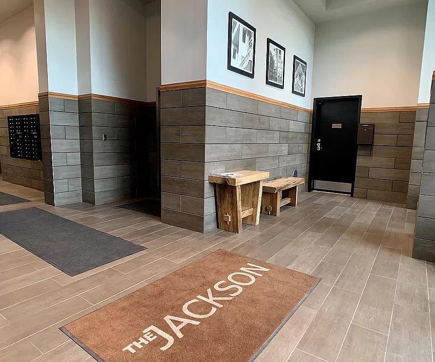 Entryway from Front of Jackson- Two Elevators, Stairwell, Mailboxes, Shelves for Resident Packages, and Entrance to (Resident-only, Private, Attached, Covered, Secure) Garage.