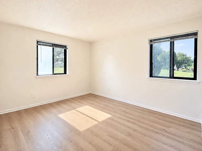 Spacious primary suite with ample natural light