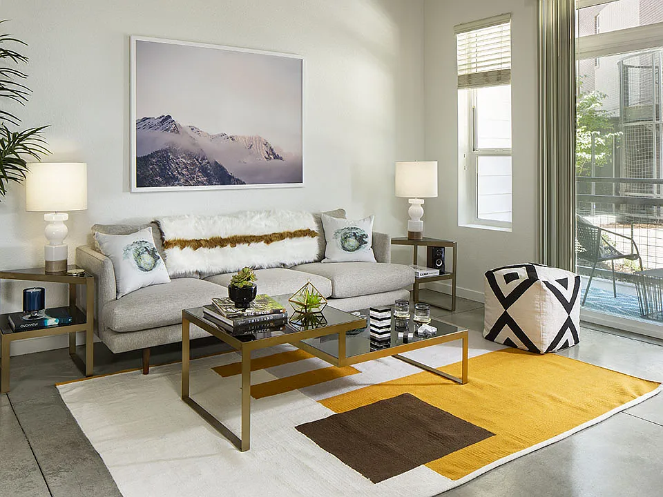 Apartment Living Room with polished concrete floors and patio.