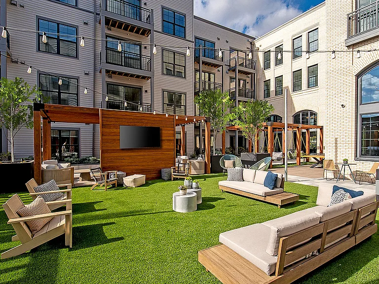 Experience modern elegance and relaxation in this beautifully designed community courtyard.