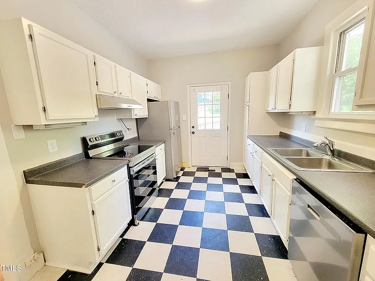 Kitchen all stainless appliances including a dishwasher