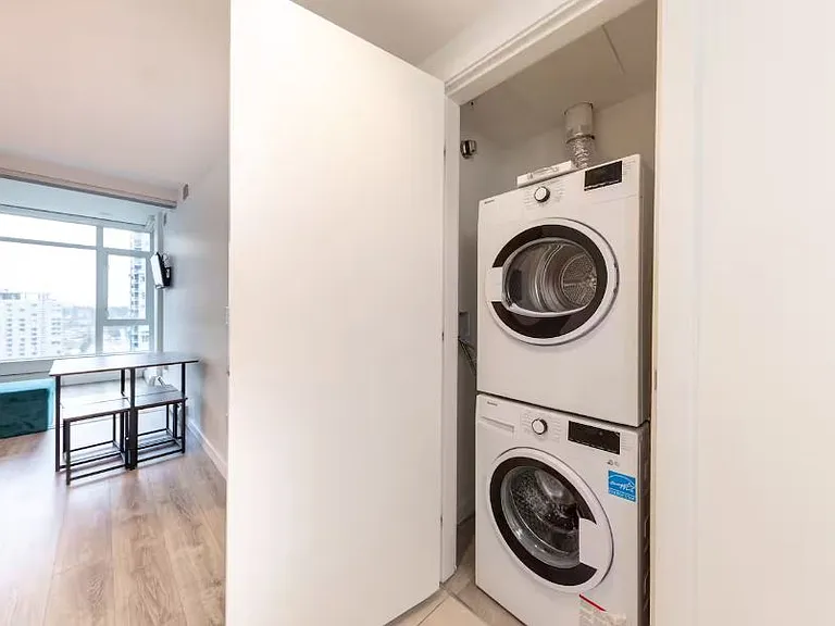 Convenient laundry area equipped with a washing machine and clothes dryer, making it easy to refresh your wardrobe during your stay.