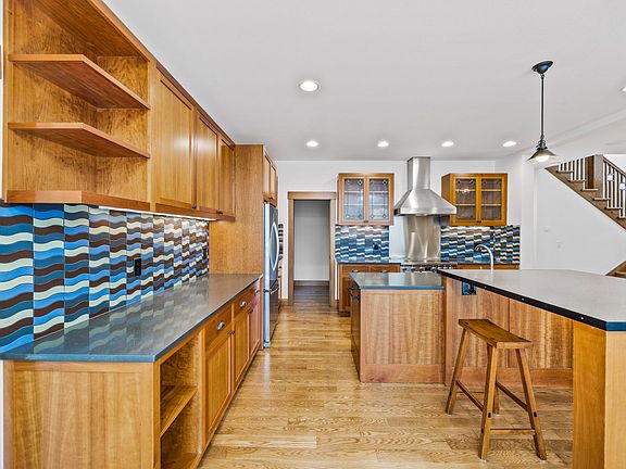 Gourmet kitchen with extra storage and walk-in pantry.