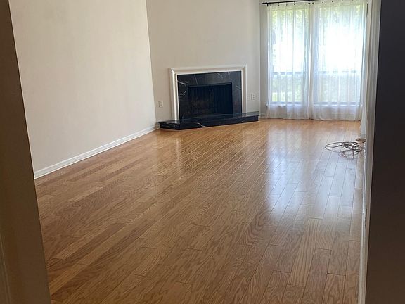 Large bright living room with hardwood floors