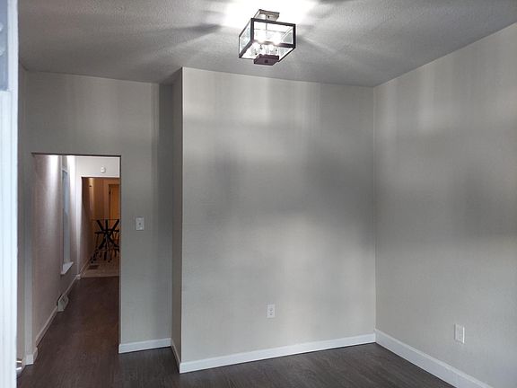 Living room looking down the hall into the kitchen.