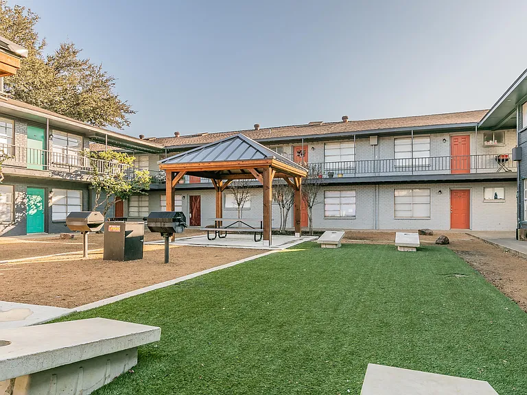 Play cornhole at Chapel Creek Apartments in Dallas