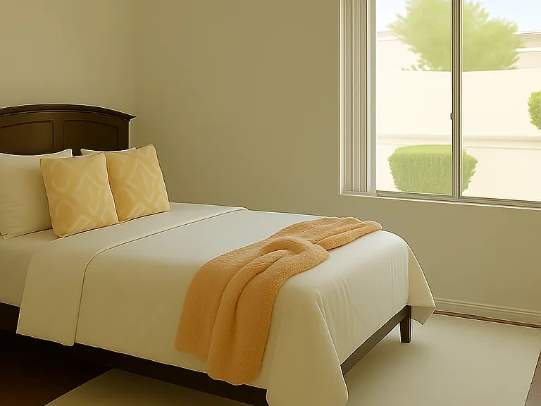 The second bedroom has a view of the pool and backyard. The flooring is the same as the master suite. There are sliding mirrored doors across the width of the room. Furniture not included.