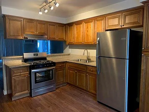 PREVIOUSLY REMODELED KITCHEN (BROWN CABINETS)