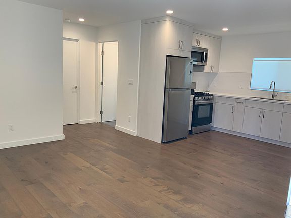 Living Room and Kitchen partial view.