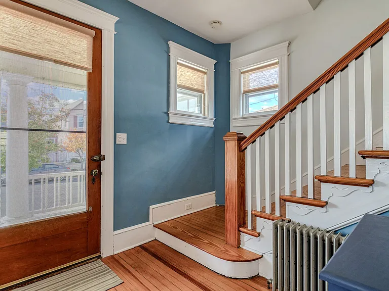 Entry way with beautiful, old, large, well-worn wood door