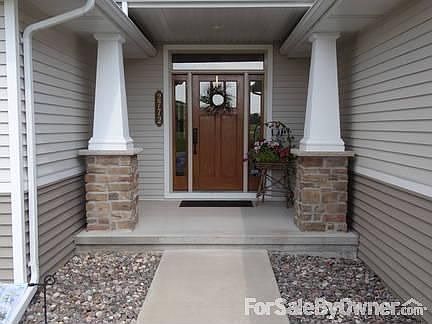 Front Door
						:
						Craftsman style pillars with stone base.