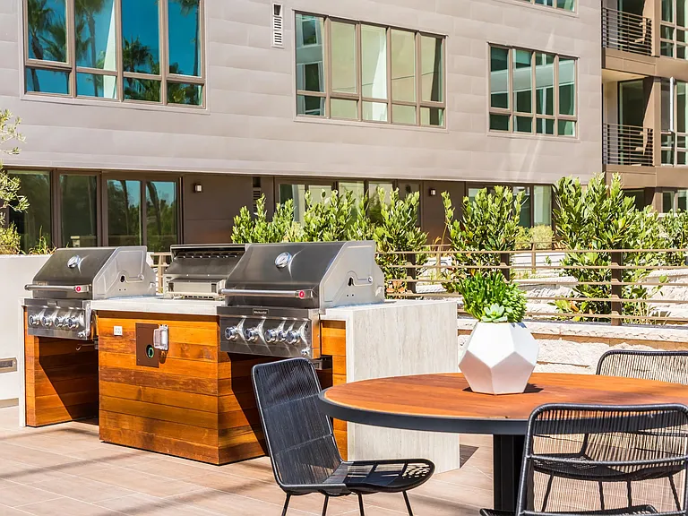 Grilling station with premium appliances for relaxed outdoor dining.